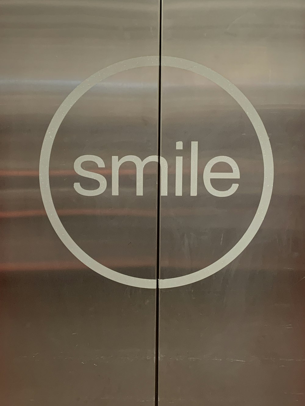 elevator door with Smile print