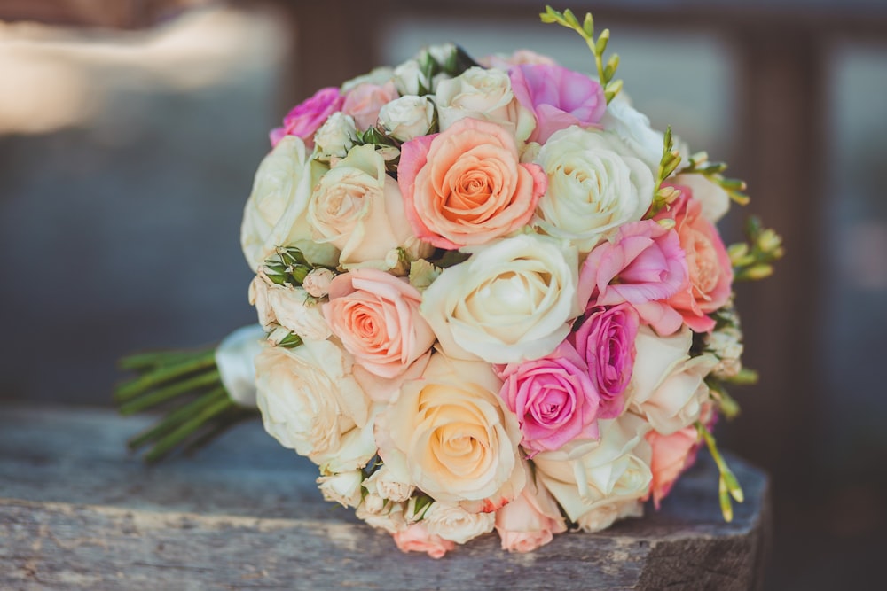 white, orange, and pink roses bouquet