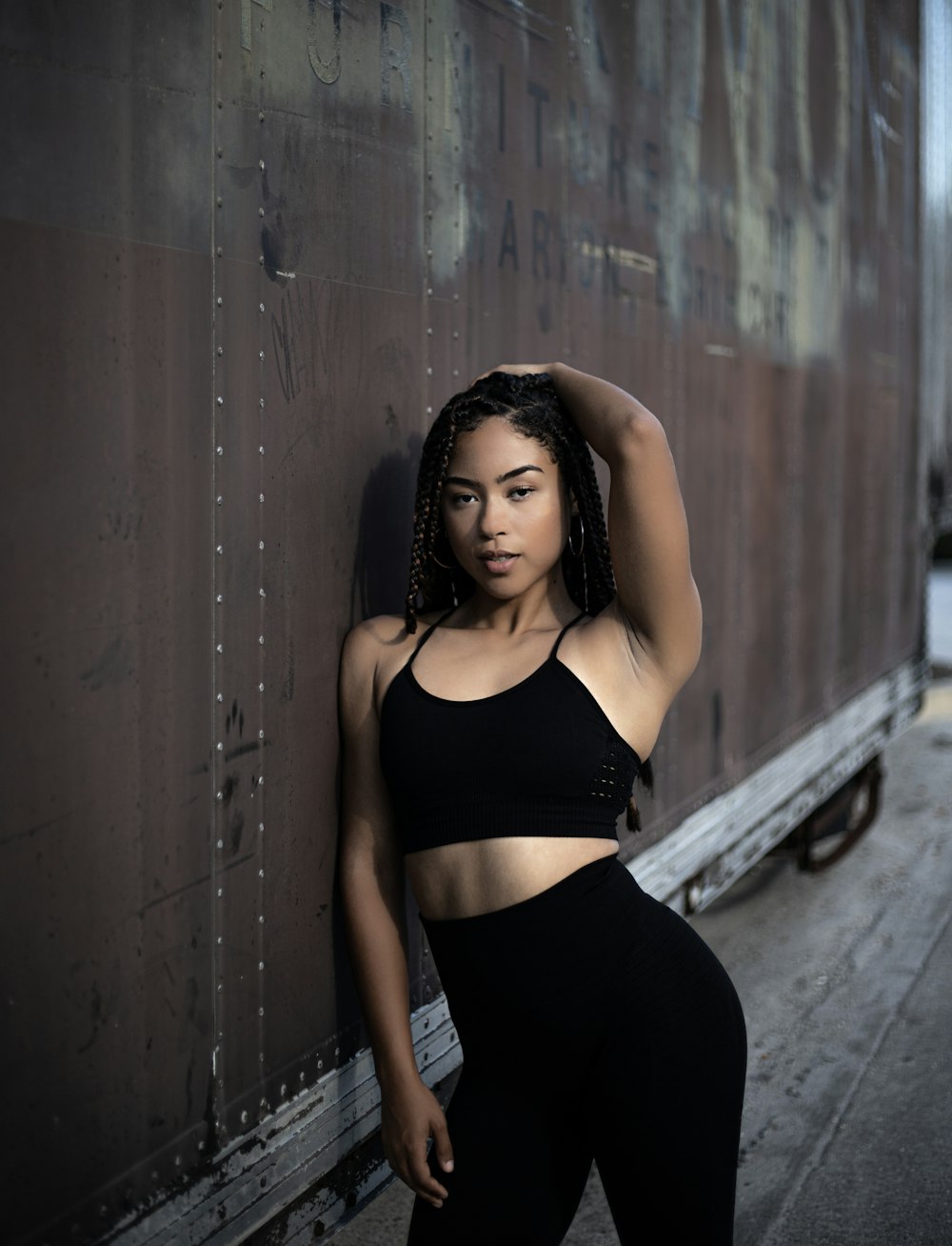 woman leaning on freight trailer