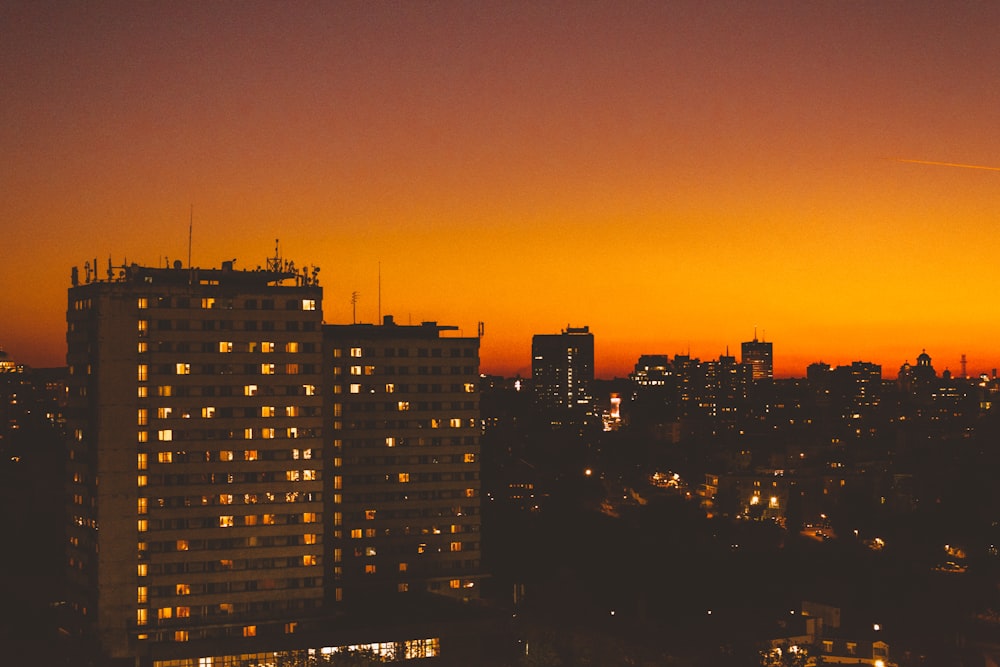 view of building with lights during golden hour