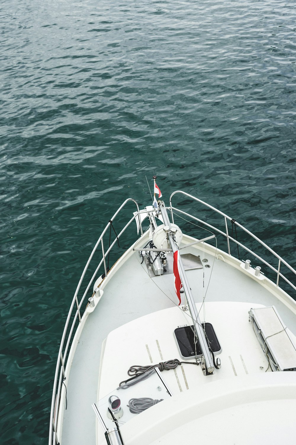 white boat on body of water during daytime