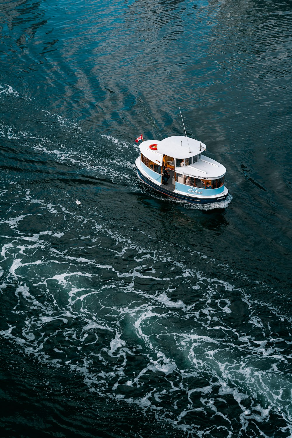 aerial photo of white boat in ocean during daytime
