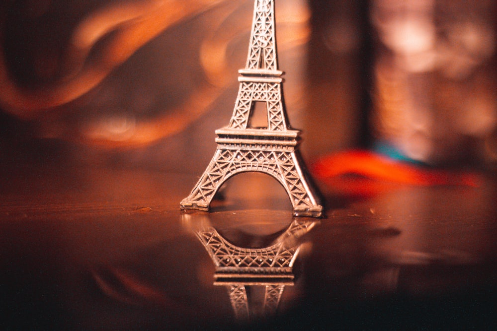 shallow focus photo of Eiffel tower miniature