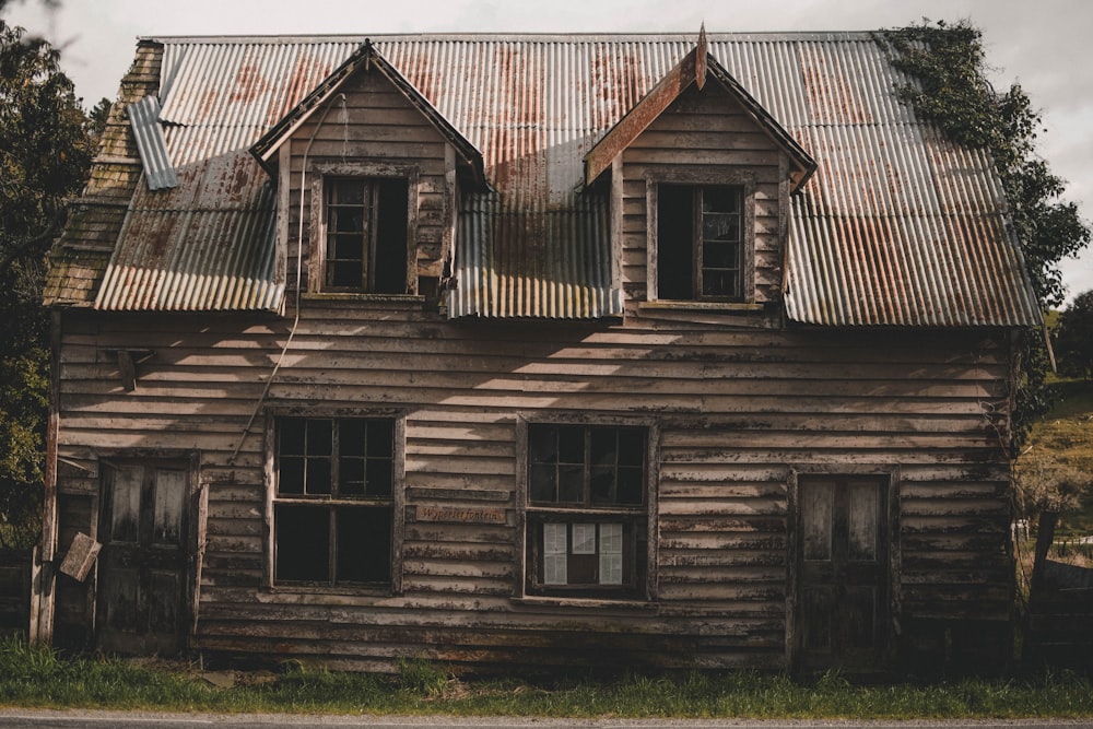 trees near brown wooden house