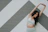 A focused woman stretching near a wall painted in Crimsoncore’s signature red and black colors.