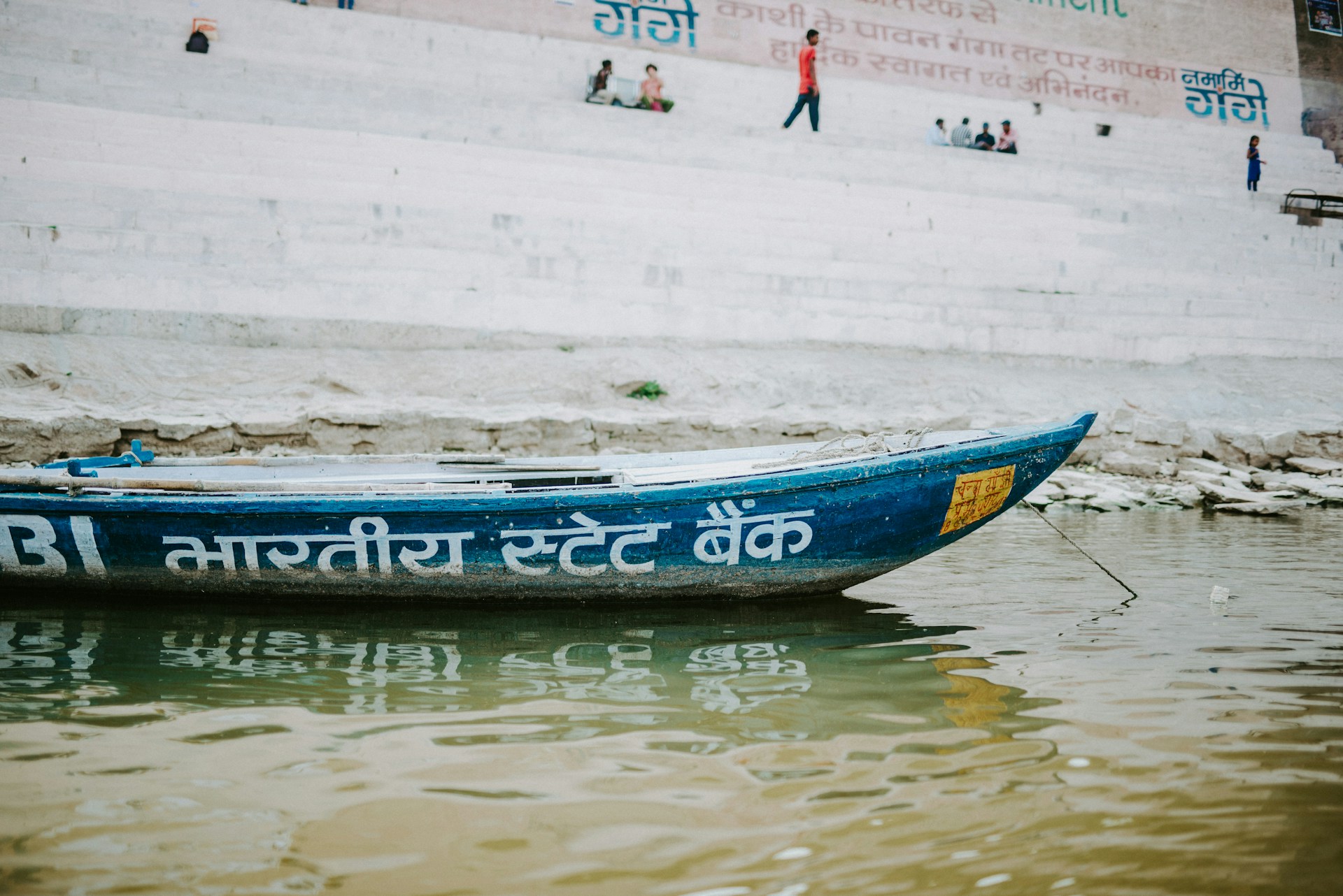 woman wearing yellow long-sleeved dress under white clouds and blue sky during daytime