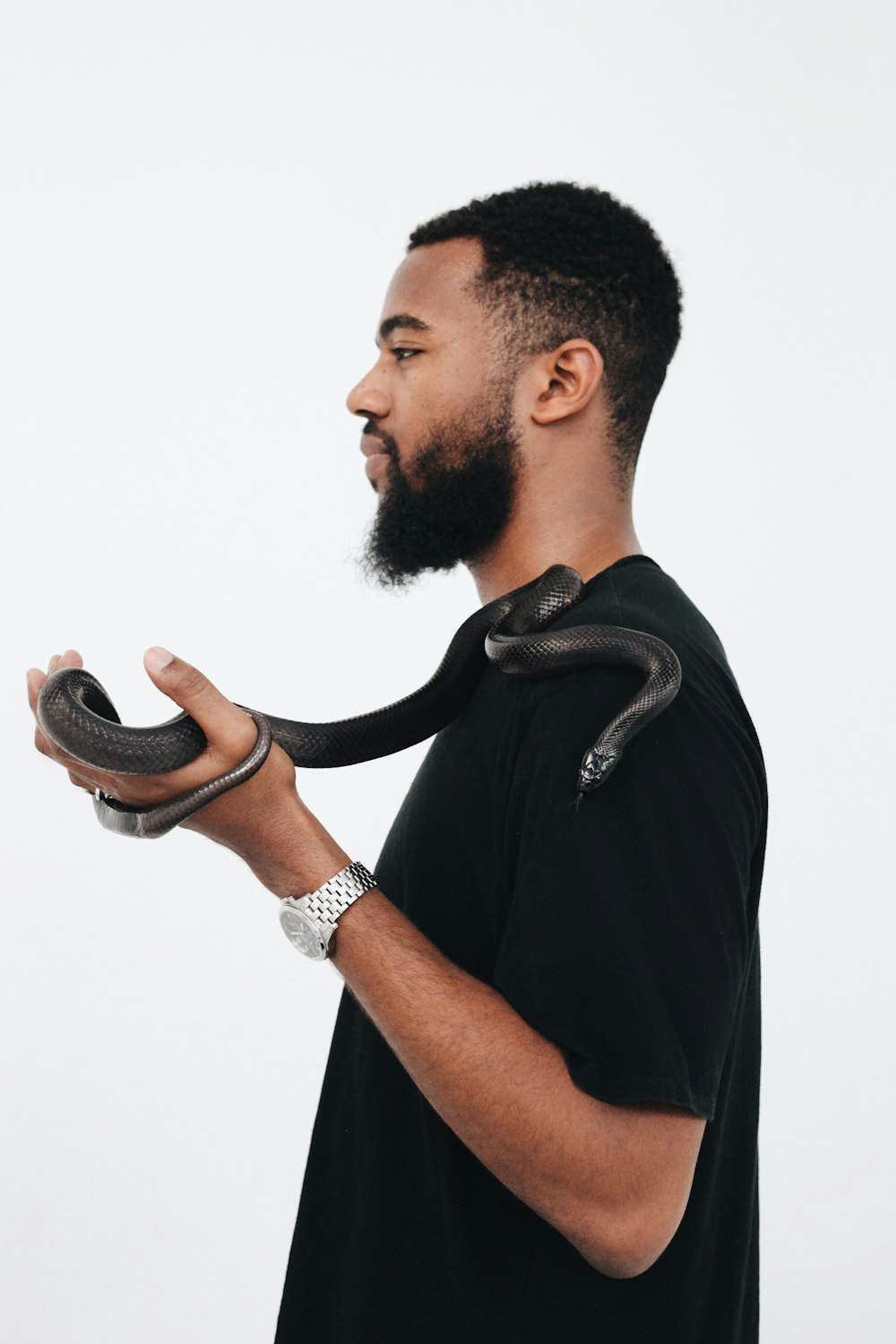 man holding snake