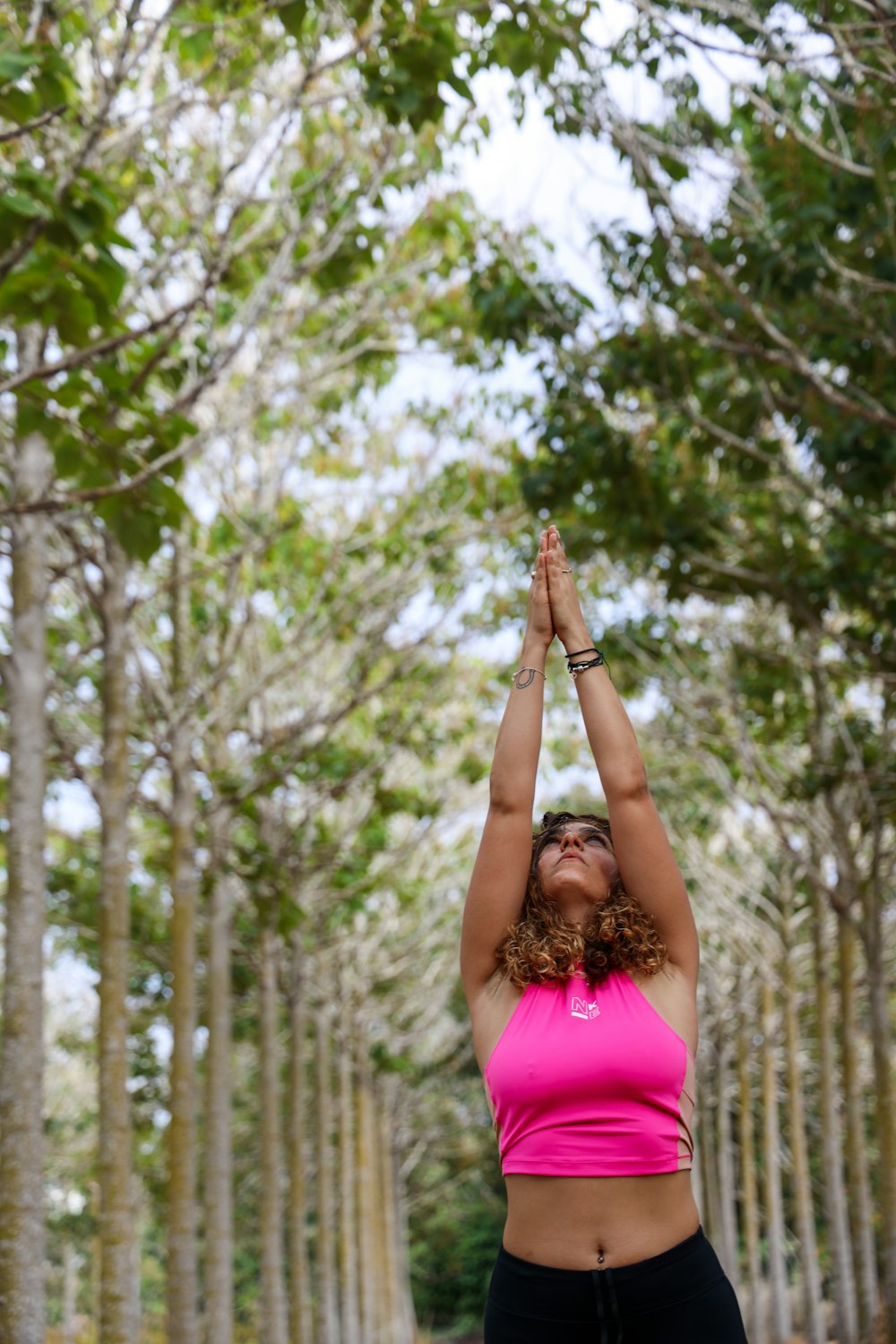 woman wearing pink crop top