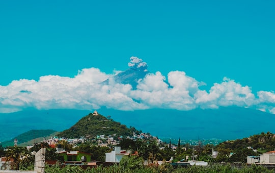 buildings and trees during day in Popocatépetl Mexico