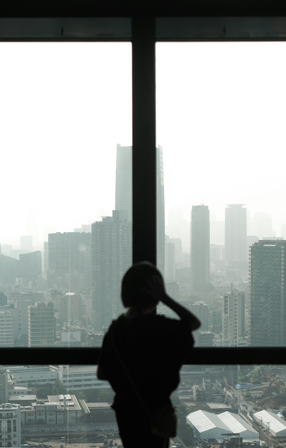 silhouette photography unknown person standing indoors