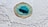 an aerial view of a blue hole in the sand