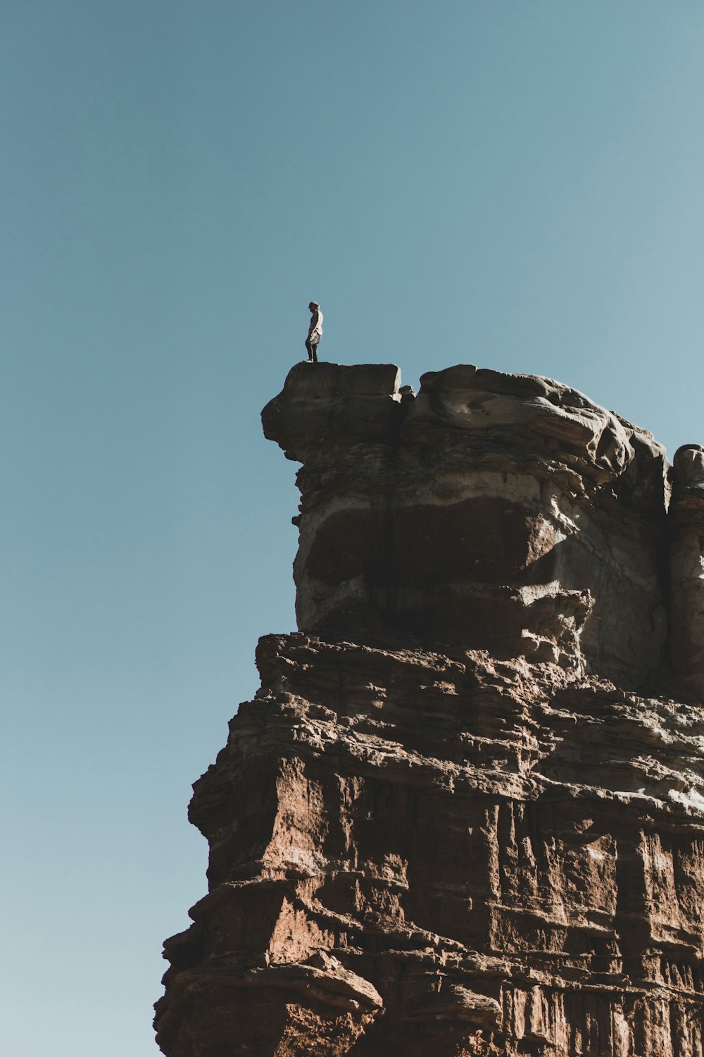 woman standing on rock formation