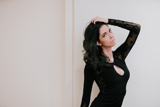 woman wearing black long-sleeved dress