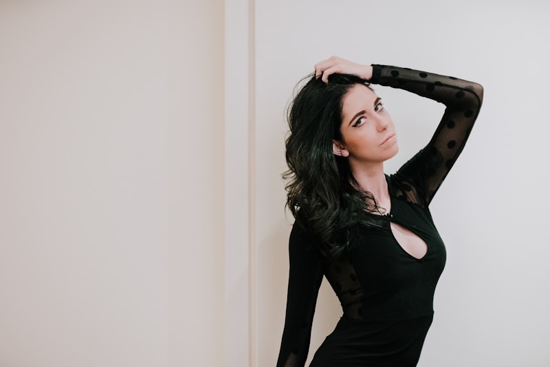 woman wearing black long-sleeved dress