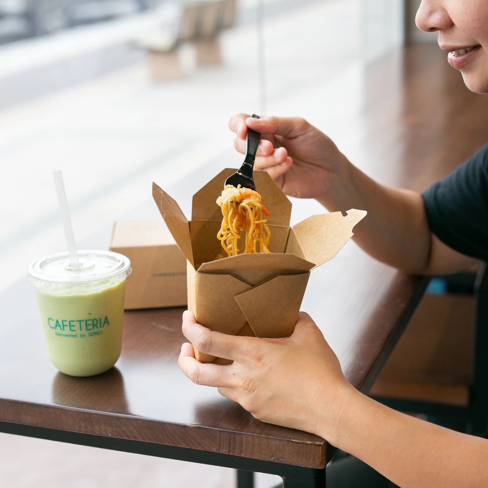 Young consumer trying a product, illustrating experiential product sampling in Singapore