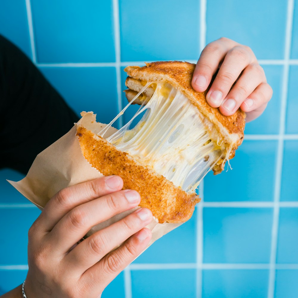 person holds brown pancake