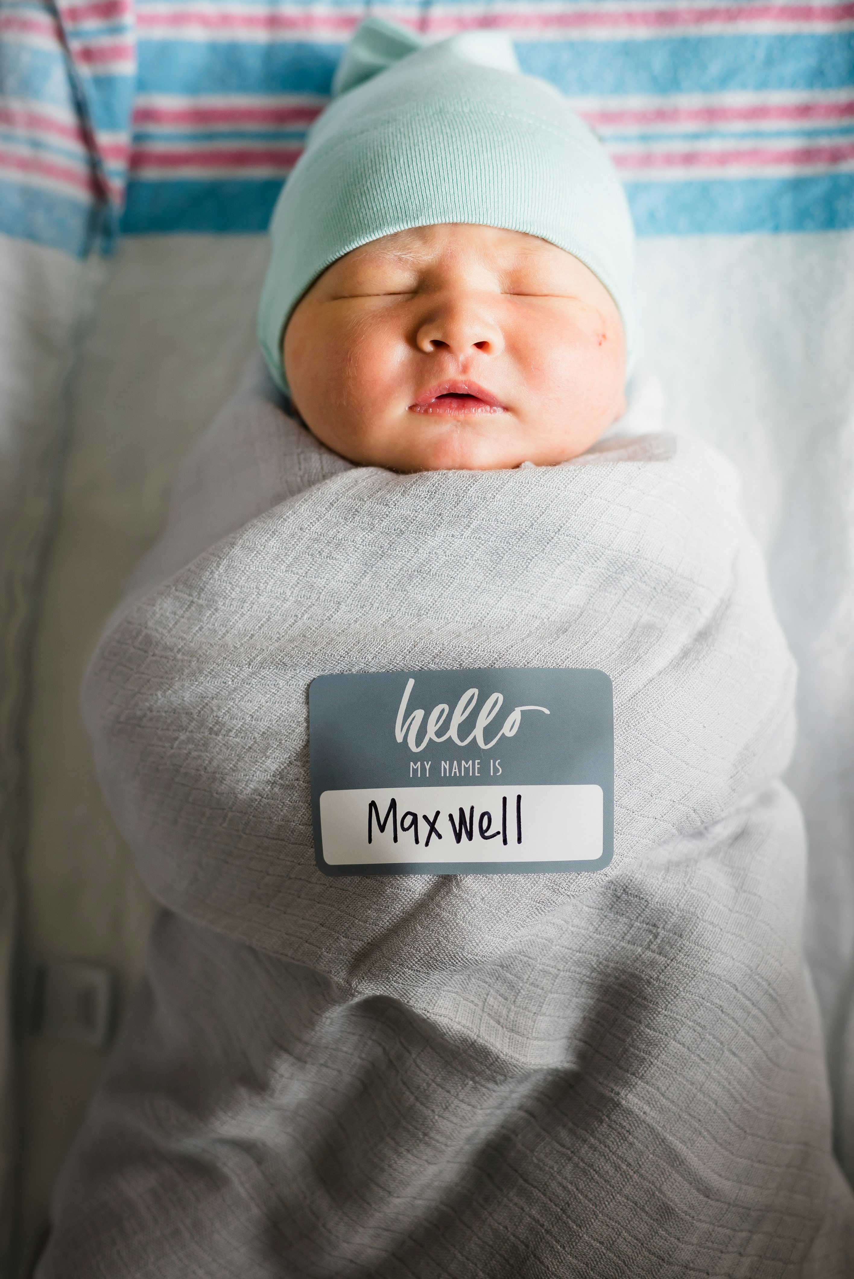 Baby In White Blanket With Maxwell Name Tag Photo Free Newborn