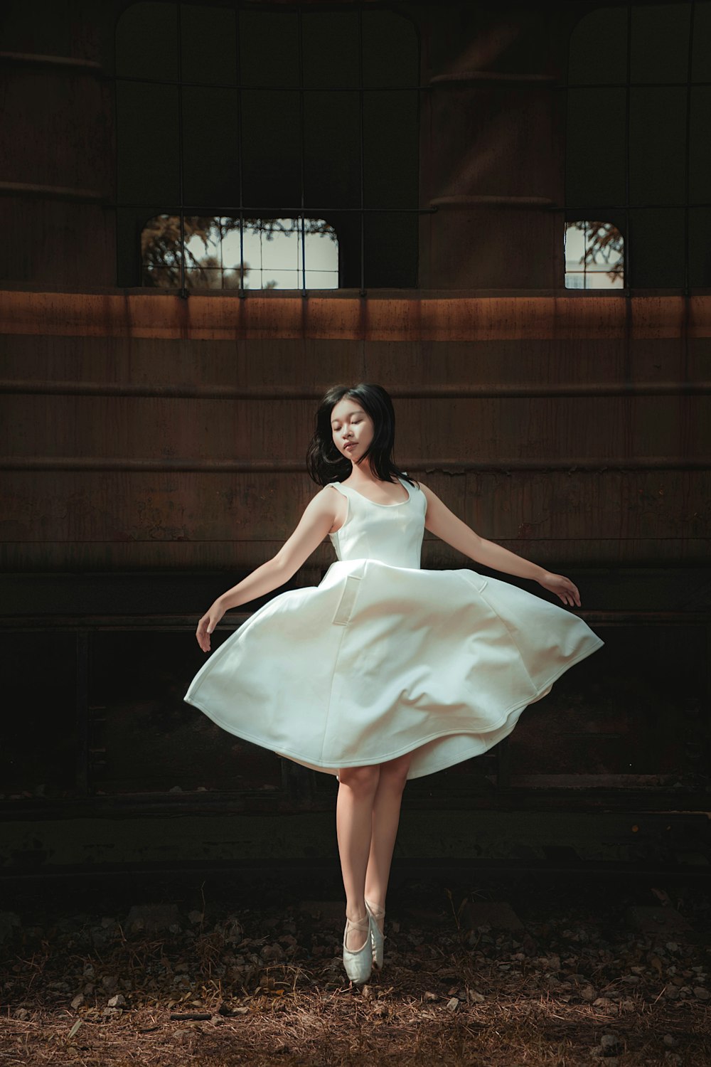 woman in white sleeveless dress