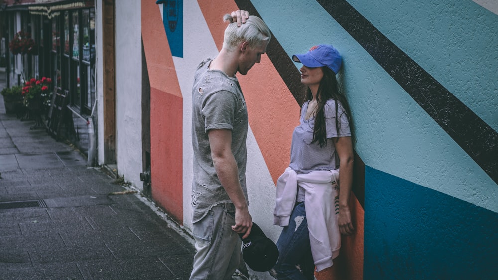 man and woman near wall