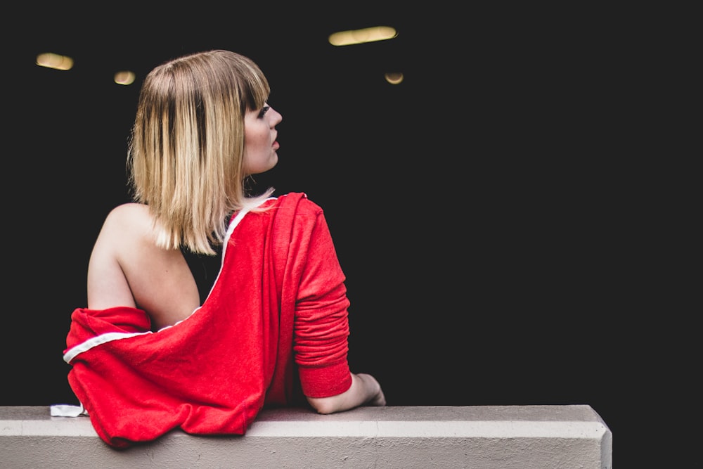 woman leaning back on railing