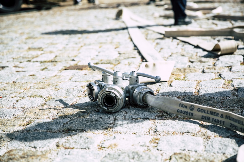 gray metal tool parts on floor