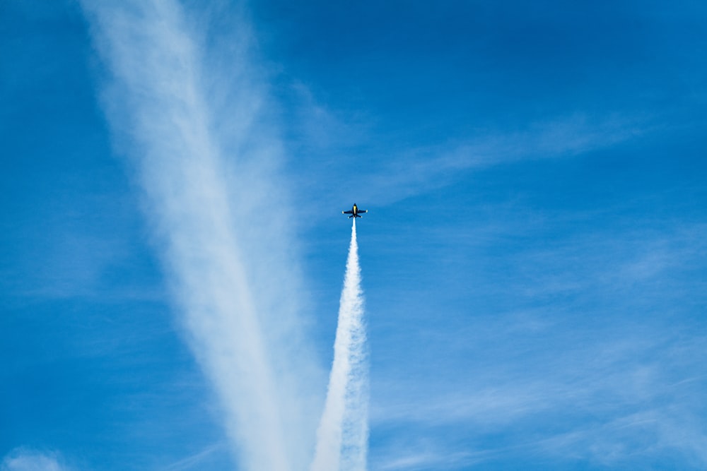 jet plane with white tracks