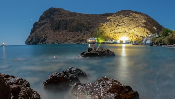 Night view of Ubatuba coastline with illuminated buildings and calm sea