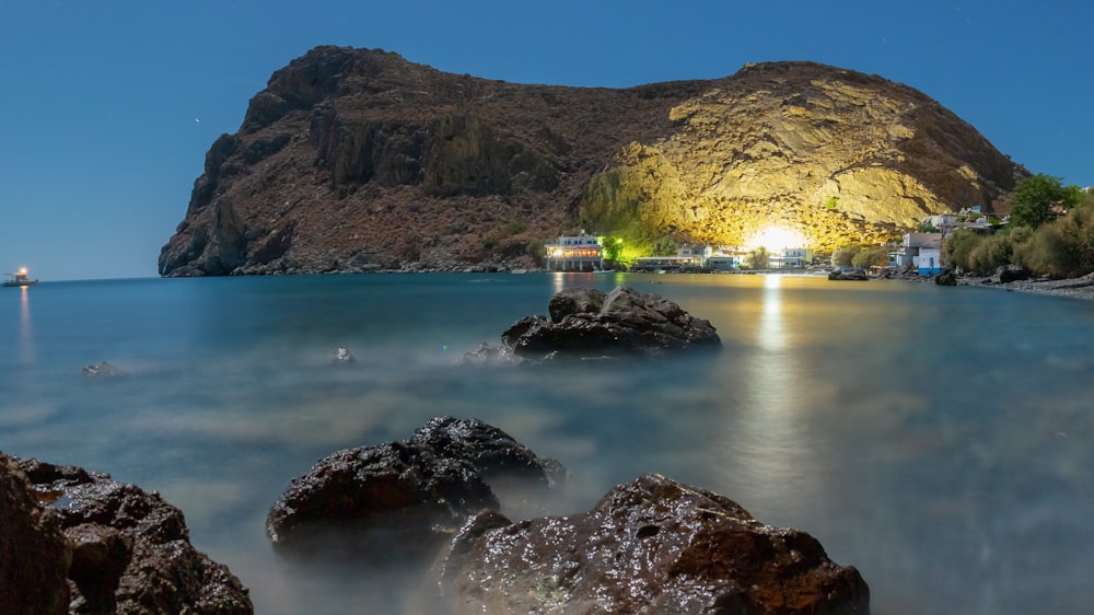 a beach with a mountain in the background