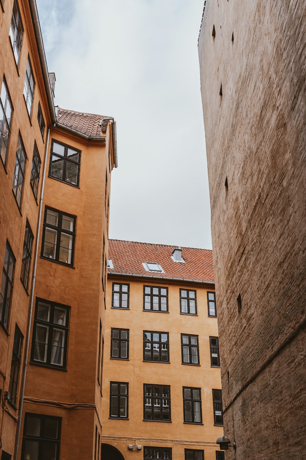 low angle photo of brown concrete houses