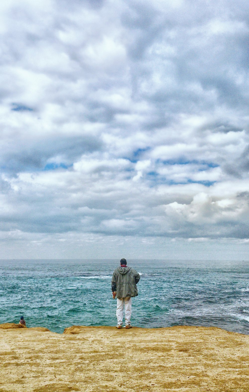man standing in front of sea