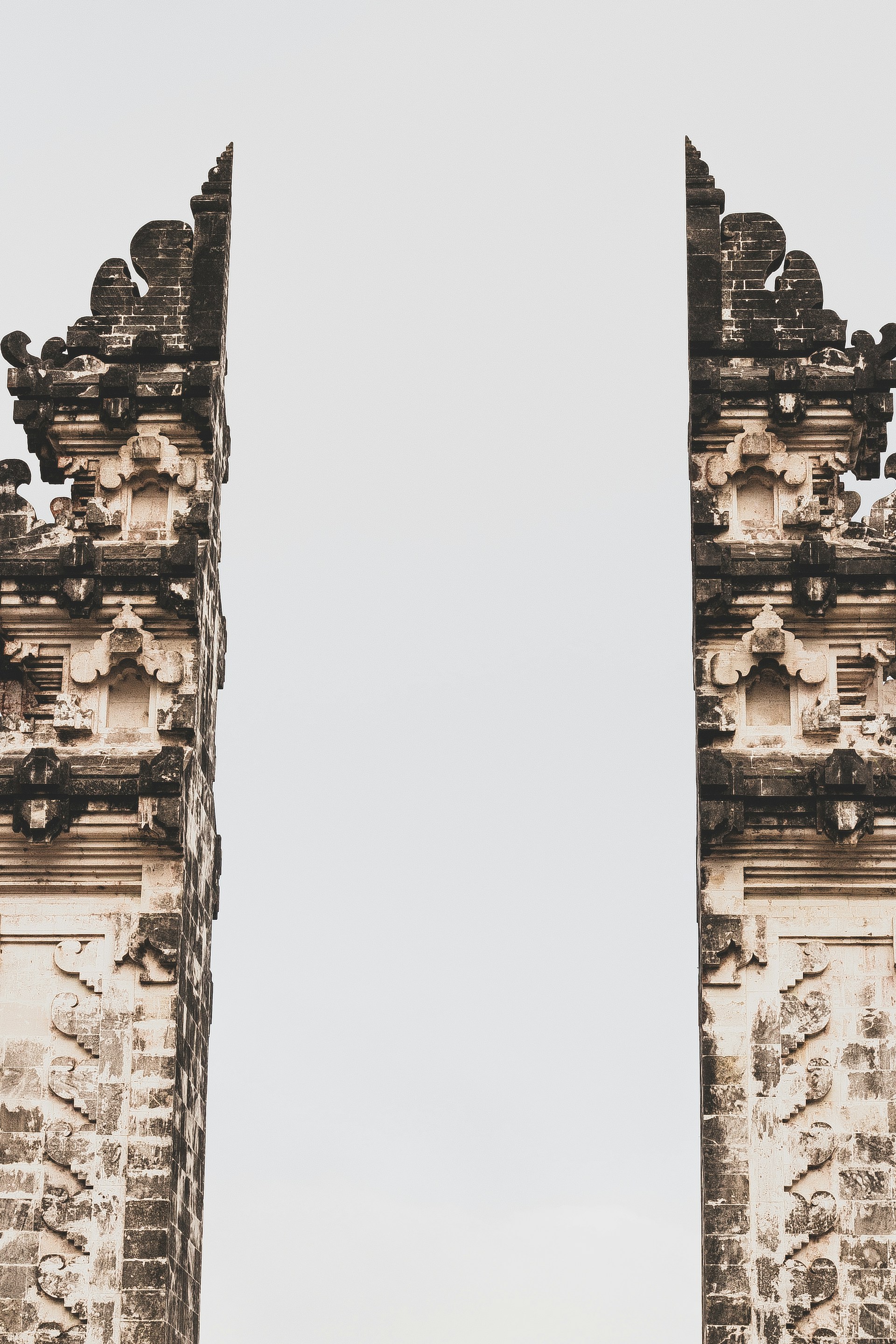 a couple of tall towers sitting next to each other