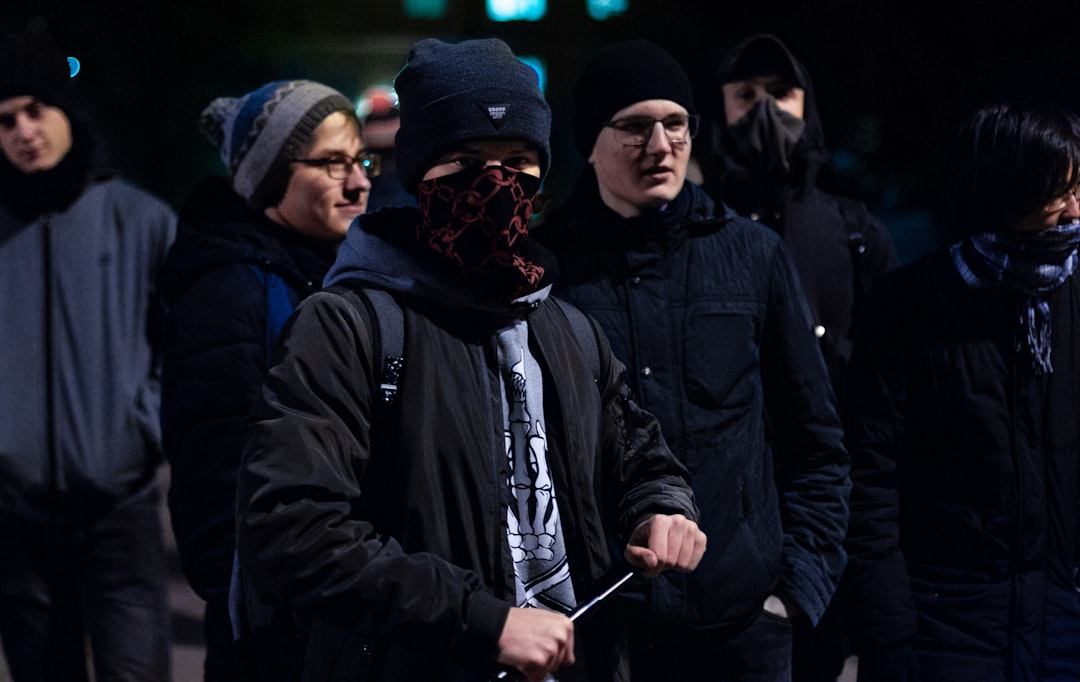 man wearing black and red handkerchief,