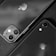Two smartphones with prominent Apple logos are positioned closely together. One phone features a dual-camera setup, while the other has a single camera. The image is in black and white, creating a sleek and modern aesthetic.