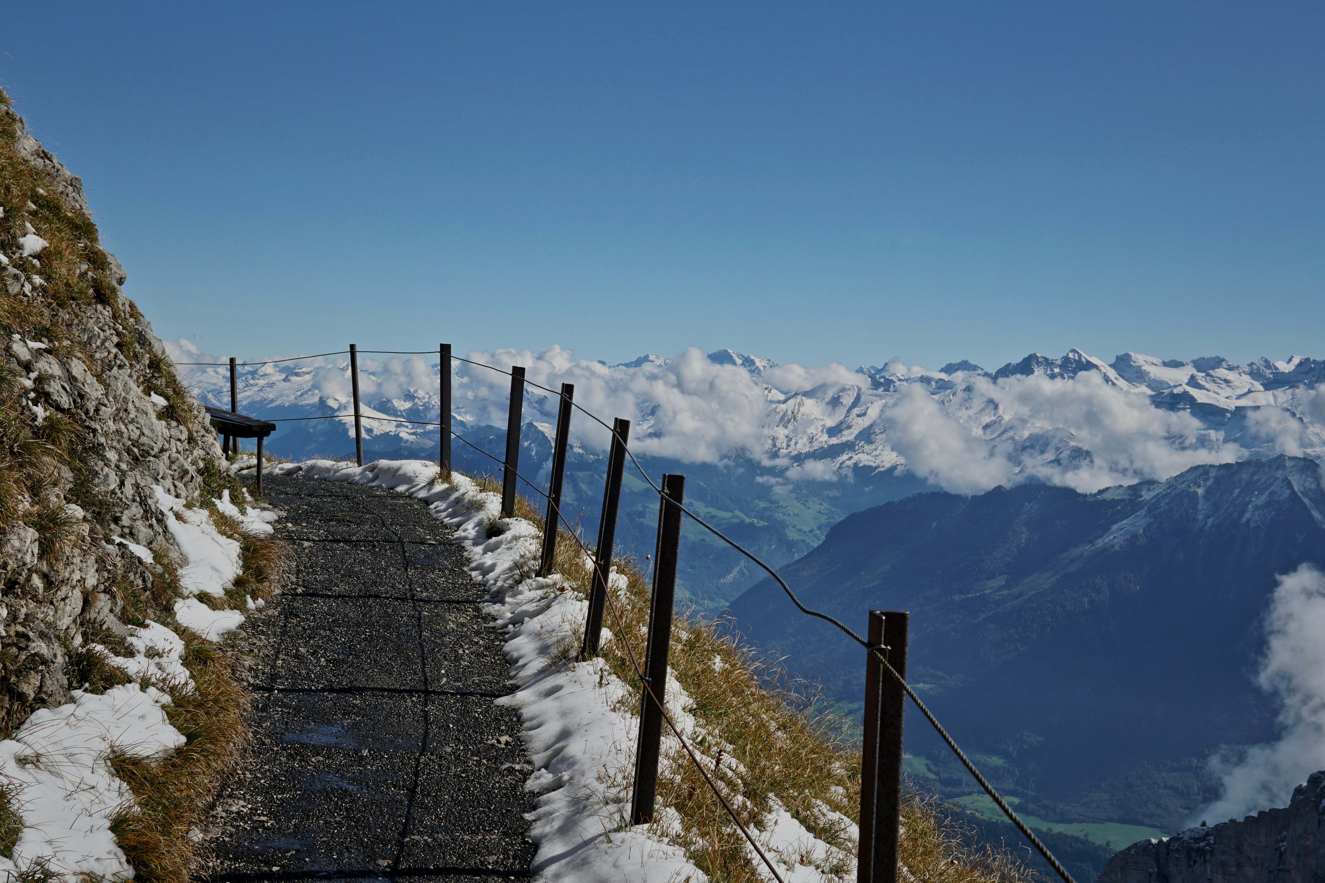 empty road beside metal rails