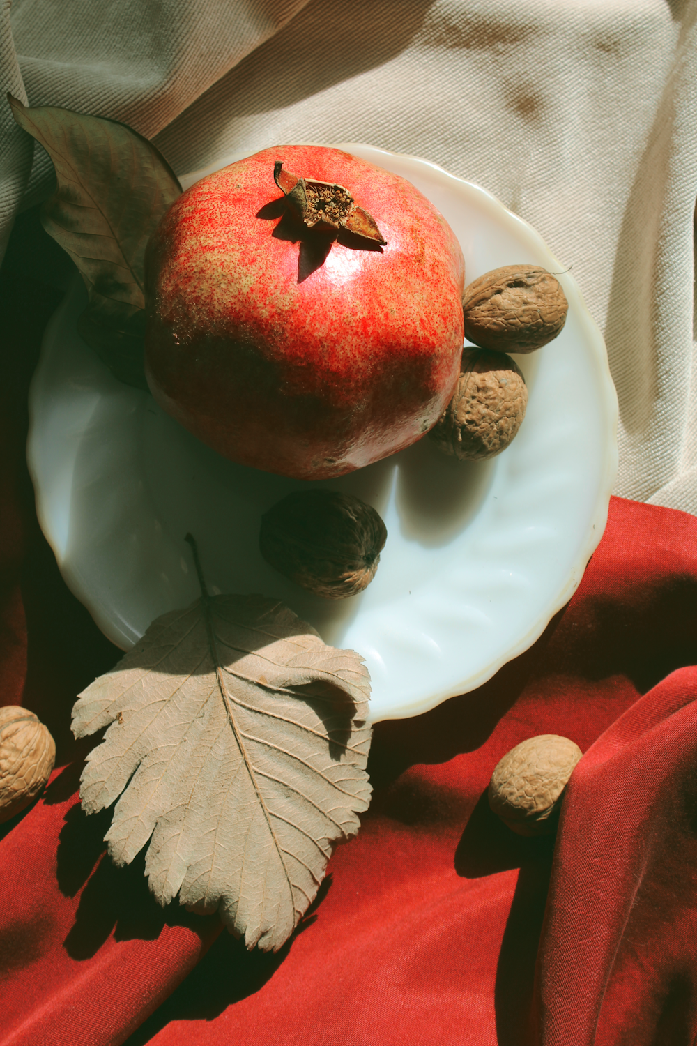 red fruit on white ceramic plate