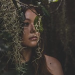 woman behind leaves