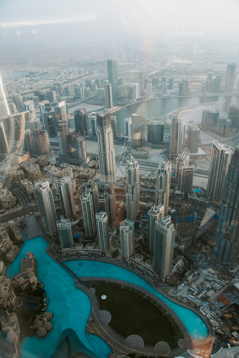 aerial photography of city with high-rise buildings viewing sea during daytime