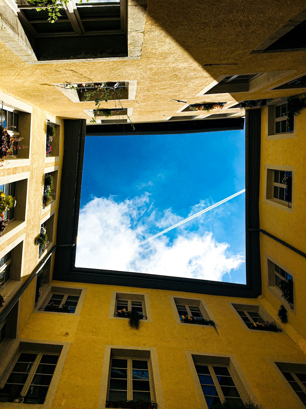 low angle photo of gray concrete buildings