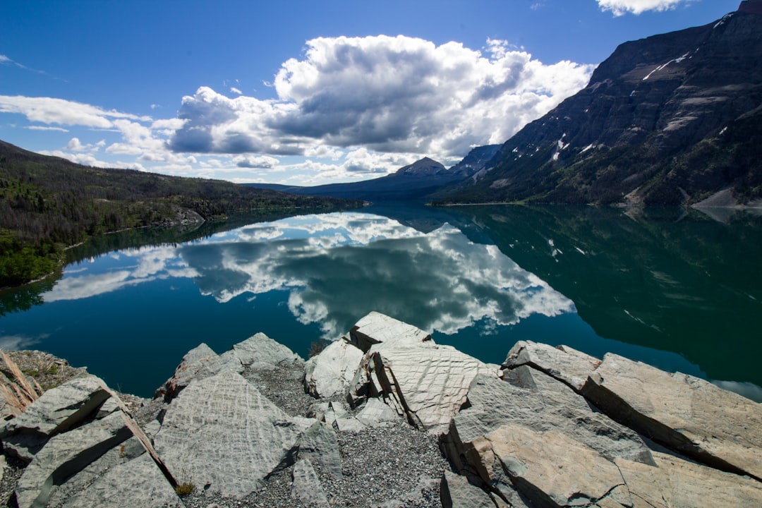 body of water under cloudy sky