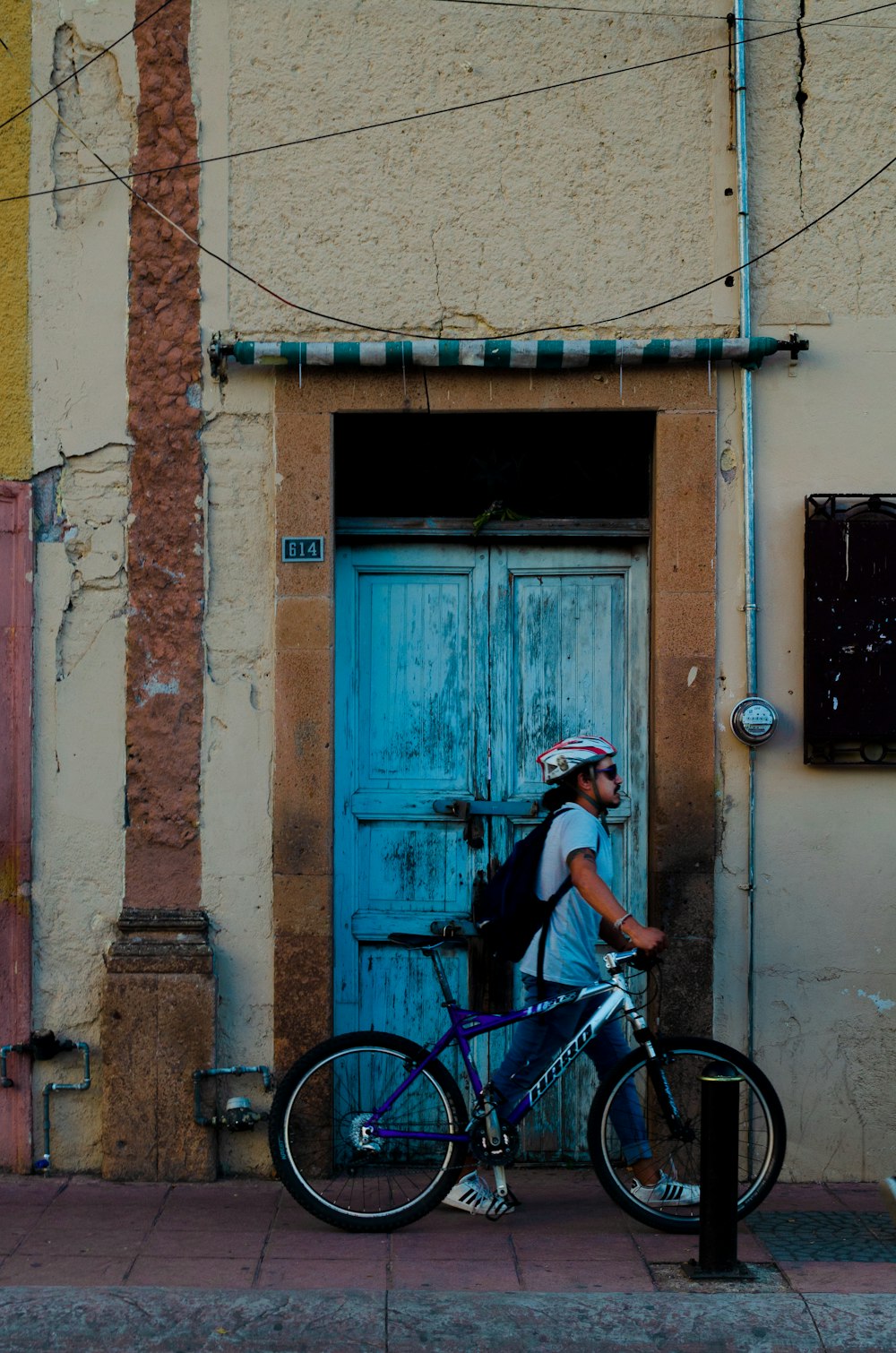 man walking with bicycle