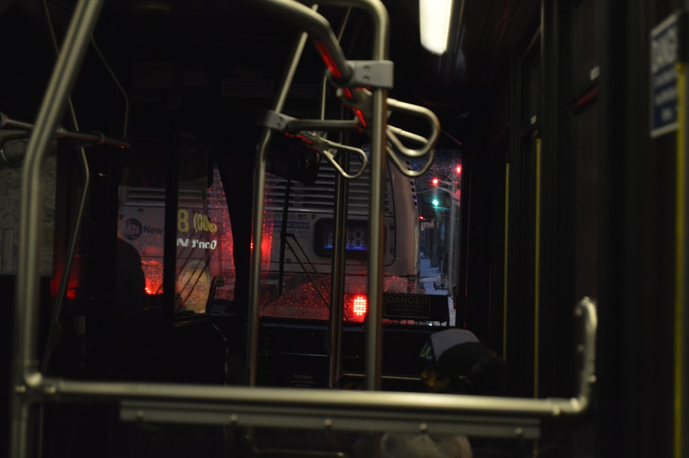a person sitting on a bus at night