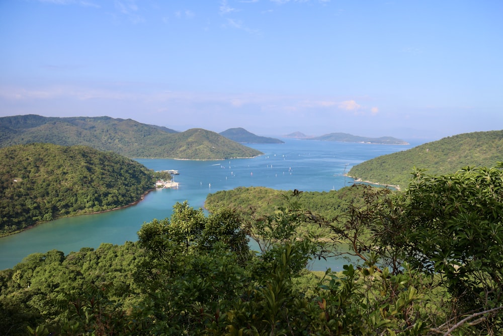 aerial photo of mountains near body of water during daytime