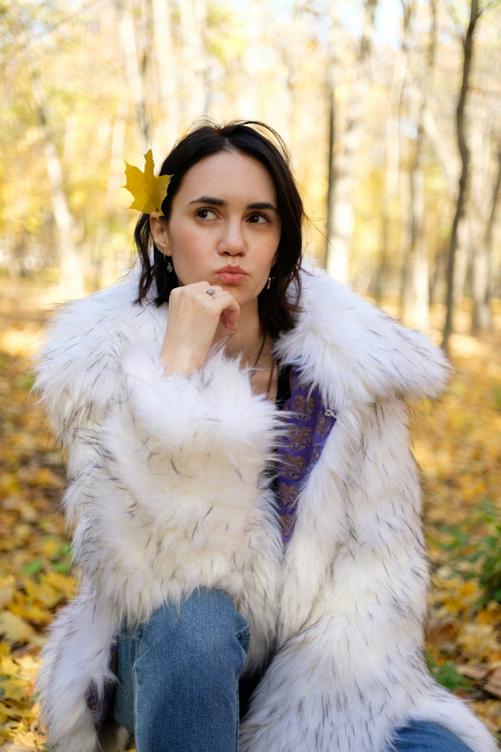 shallow focus photo of woman in white fur jacket