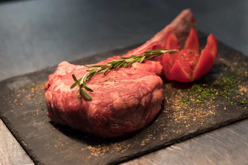 medium-rare steak with rosemary on top