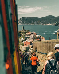 Group of happy travelers exploring a scenic coastal town