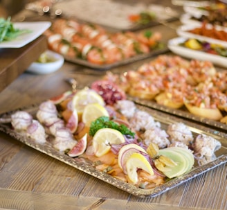 assorted foods on tray on wooden surface