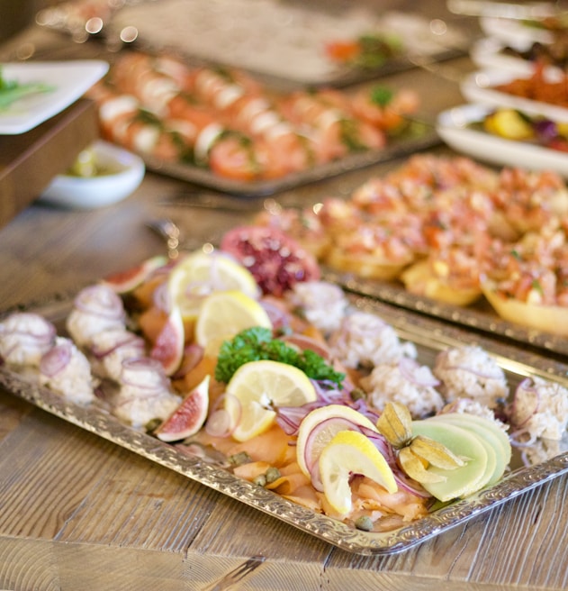 assorted foods on tray on wooden surface