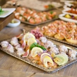 assorted foods on tray on wooden surface