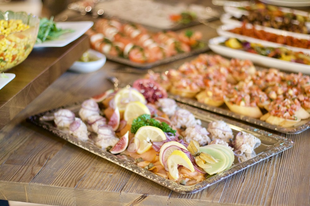 assorted foods on tray on wooden surface