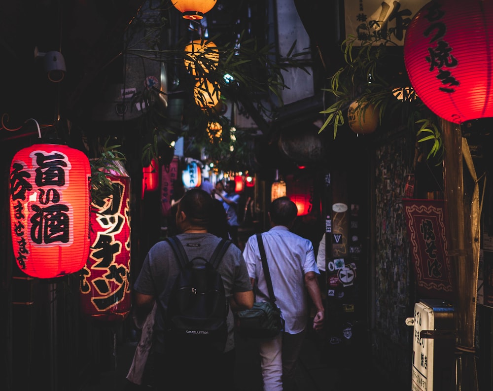 men walking on dark alley